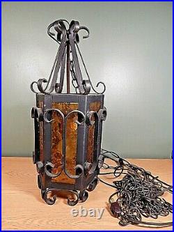Vintage Wrought Iron Large Hanging Light Spanish Gothic Style Amber Glass Panels